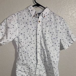 white button up shirt with blue planes